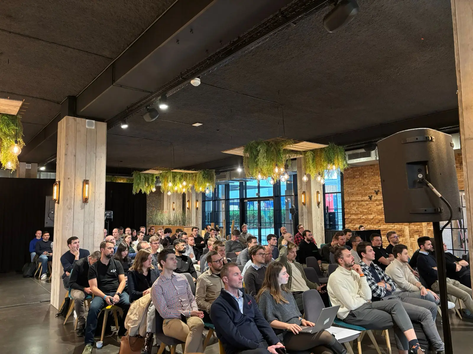 A full session room at Winterfest 2025, seen from the back of the audience